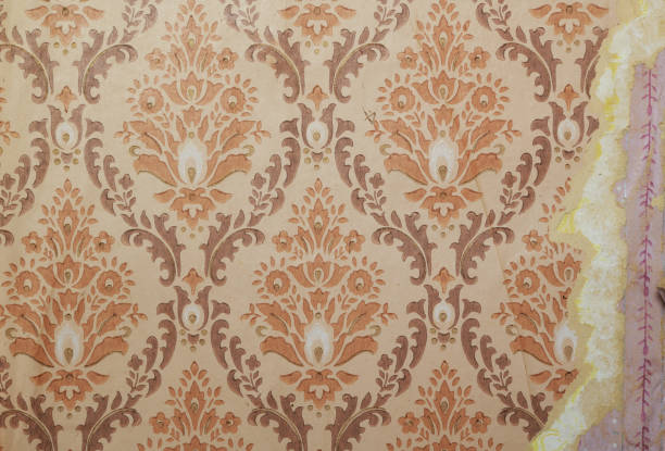 istock Old wallpaper on the wall. Old torn wallpaper for texture or background. 1494857725