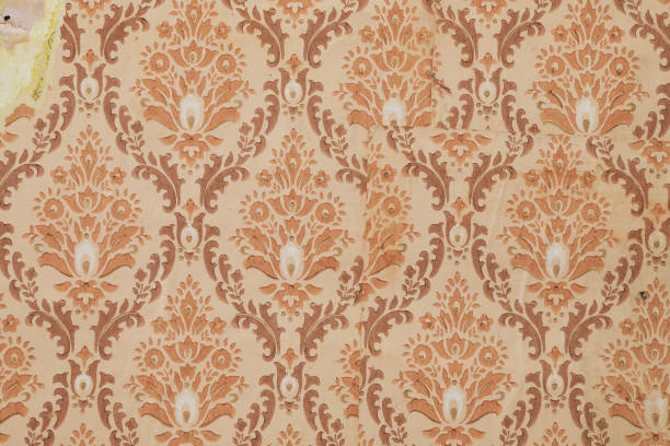 istock Old wallpaper on the wall. Old torn wallpaper for texture or background. 1494857734