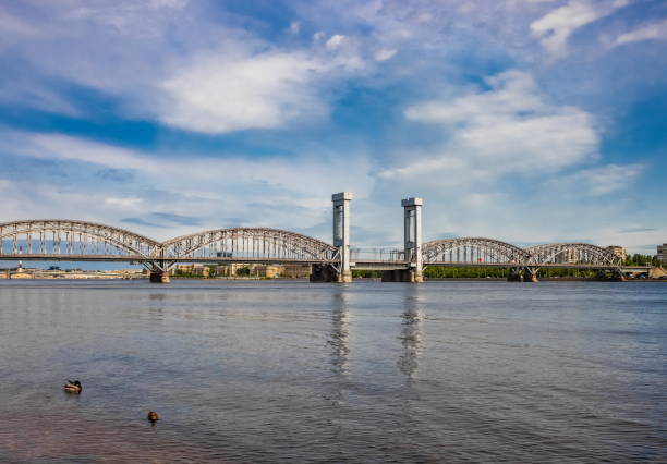 istock Railway bridge over the Neva river. There is a train going over the bridge. 1494857784