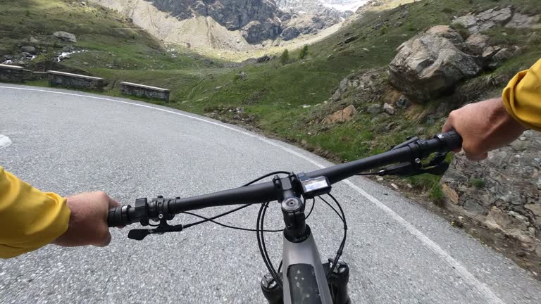 First person perspective on biking along rugged trail