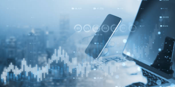 istock Close up of man hand using laptop and mobile phone with creative candlestick forex chart or graph on blurry wide city background. Financial trade market and stock concept. Double exposure. 1494866485