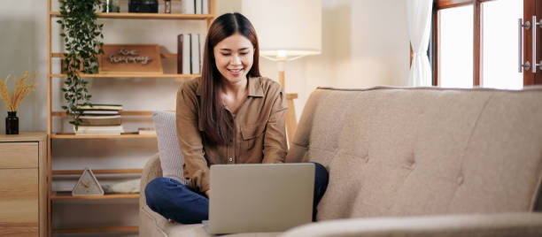 istock Female entrepreneur reading new business project and typing data 1494867396