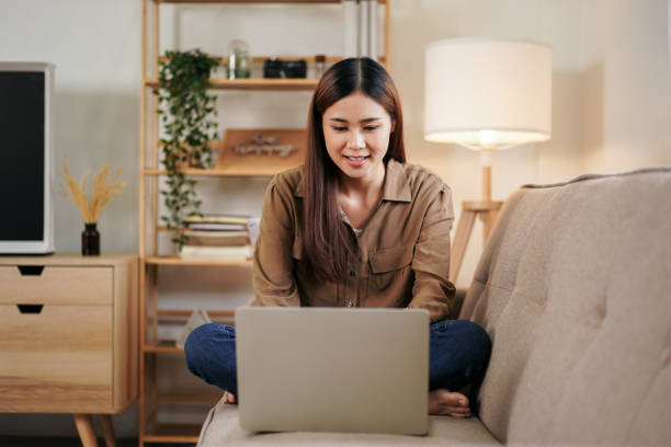 istock Female entrepreneur reading new business project and typing data 1494867405