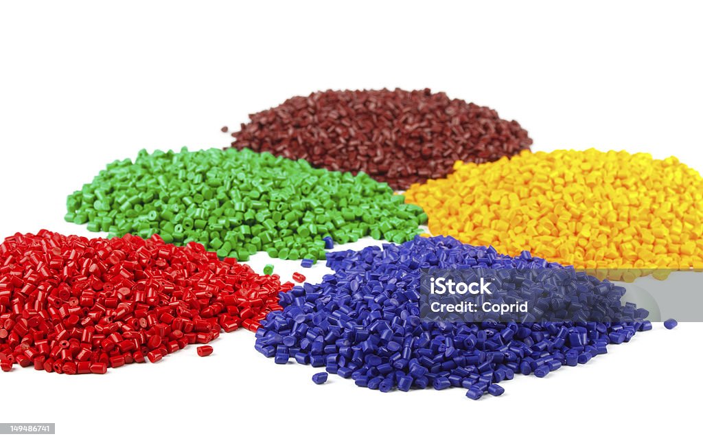 Colourful plastic granules Colourful plastic polymer granules isolated on white Granule Stock Photo