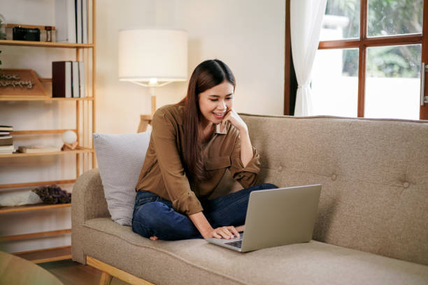 istock Female entrepreneur reading new business project and typing data 1494867415
