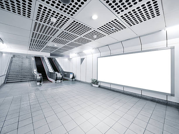 istock A staircase and an escalator with a white billboard 149486946