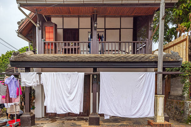Luang Prabang, Laos - March 16th 2023: Laundry put out to dry along side the road is a common sight in the former capital of Laos