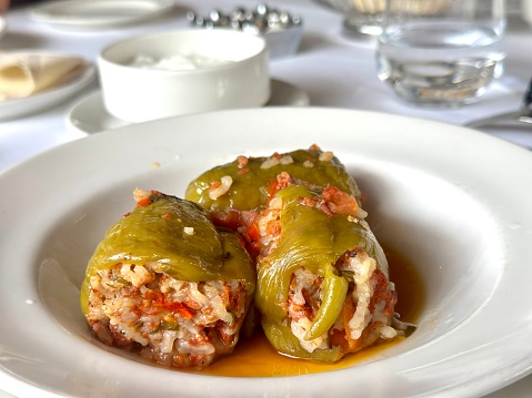 Preparing Stuffed Bell Peppers with Ground Meat in Tomato Sauce
