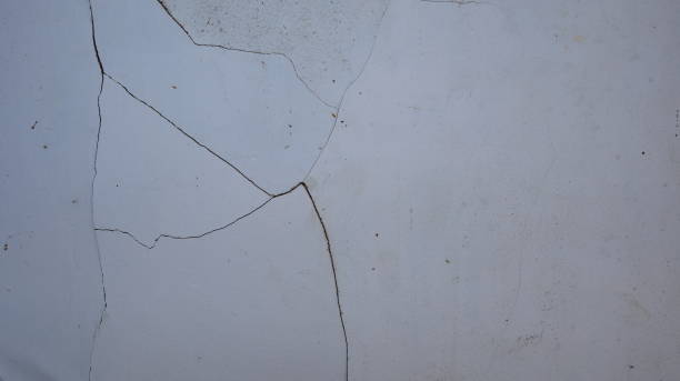 istock Cement wall collapse. Cracked concrete old wall. dangerous, damaged building structure. 1494871036