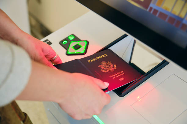 A person checking-in for a flight at the airport with the automated passport kiosk.