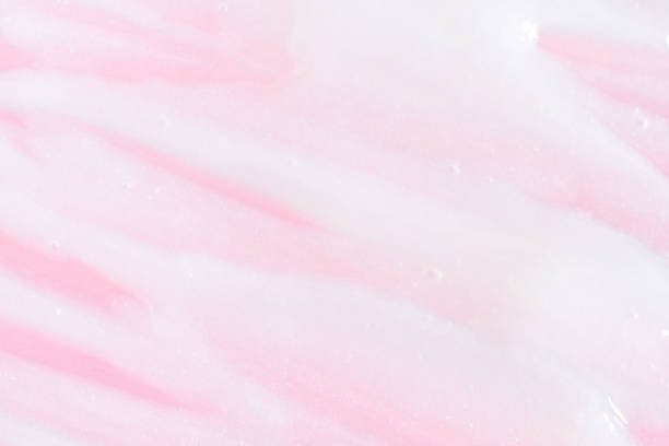 istock Smeared greasy melting cream. On a pink background. 1494875091