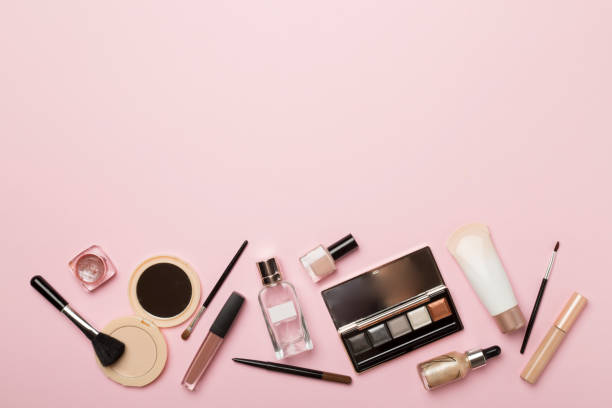 istock Different makeup products on color background, top view 1494876867