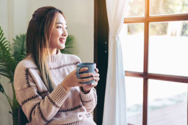 istock Woman drinking hot chocolate to enjoying dreamy and relaxing wit 1494878964