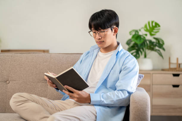 istock Businessman in casual is sitting on comfortable sofa to relaxati 1494879260