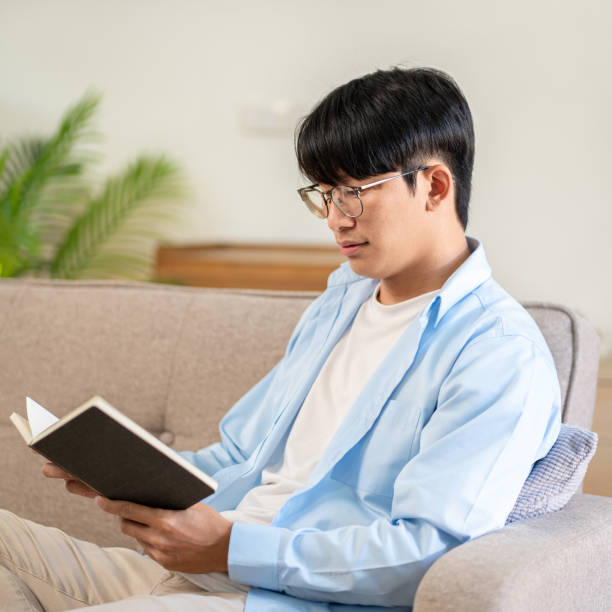 istock Businessman in casual is sitting on comfortable sofa to relaxati 1494879277