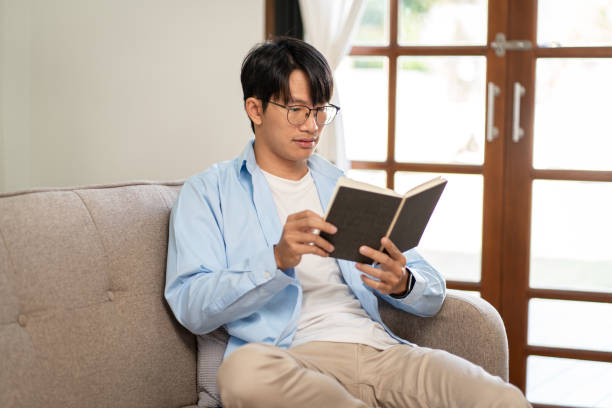 istock Businessman in casual is sitting on comfortable sofa to relaxati 1494879278