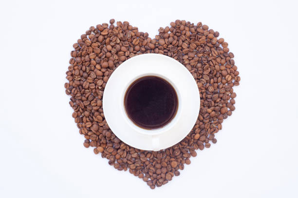 istock coffee cup and coffee grains on a white background 1494881615