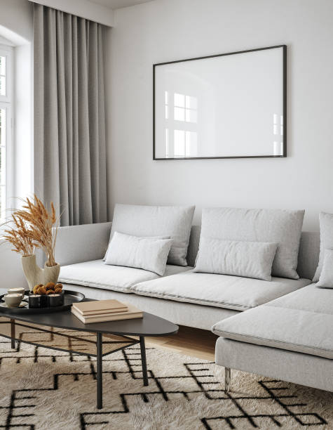 Mockup frame in Scandinavian living room interior with grey sofa, table and decor stock photo
