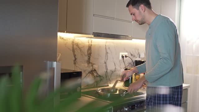 Man preparing a breakfast at home
