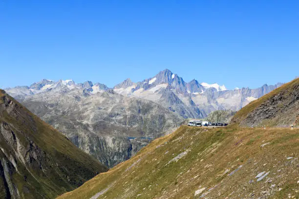 Panorama view with mountain Finsteraarhorn and Furka Pass road in the Swiss Alps, Switzerland
