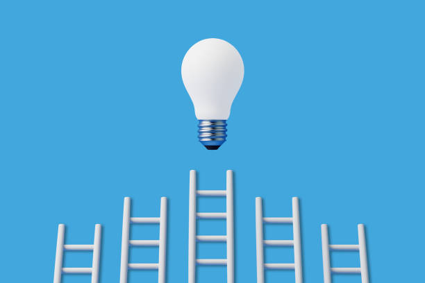 istock Stairs reach a light bulb representing an idea or business on a blue background 1494890635