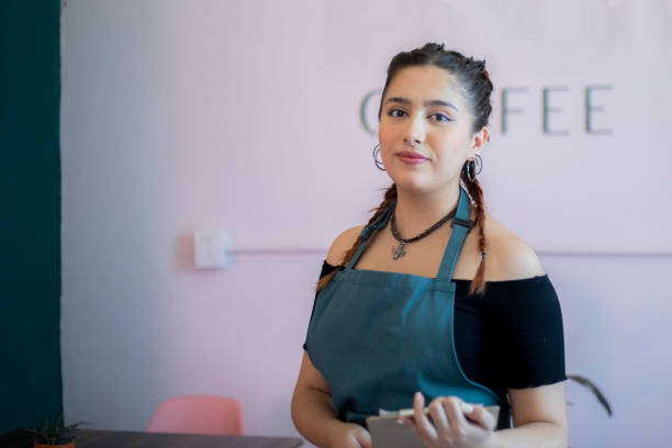 istock Portrait of waitress in cafeteria 1494892261