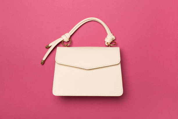 istock Fashionable leather bag on color background, top view 1494899037