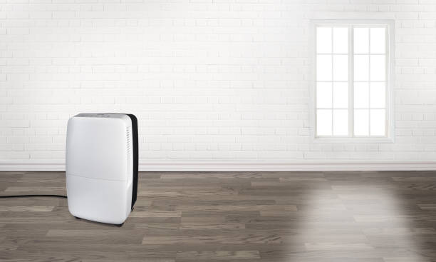 istock Portable air conditioner in an empty room 1494899697