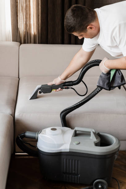 istock Domestic cleaning service cleaner is removing dirt and dust from couch using dry cleaning extraction machine. Line on couch after dry cleaning with washing vacuum cleaner extractor machine. 1494903761