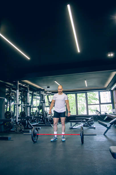 istock Strong man is preparing to train a deadlift in the gym 1494903790