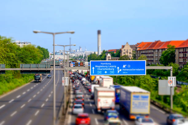 North Rhine-Westphalia, Germany - August 28, 2021: Road traffic on the German Highway (Autobahn, Bundesautobahn) A2 with road signs.