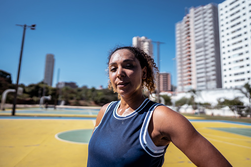 Portrait of a mid adult woman on a sport court