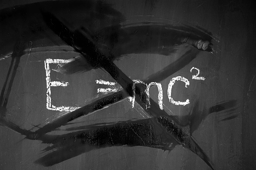 physical formula. Black school board. E mc2