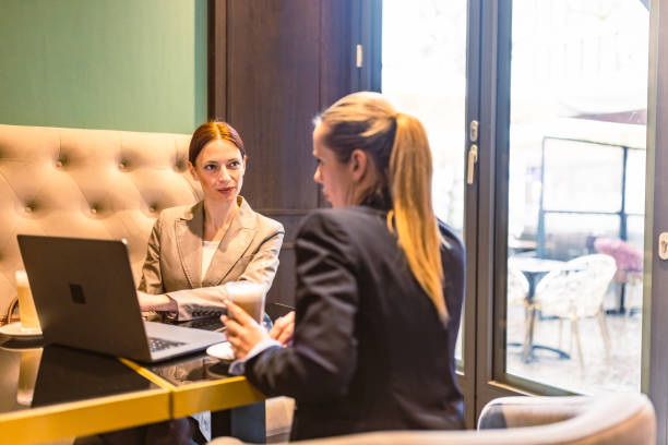 istock Colleagues business talk in a cafeteria 1494907597