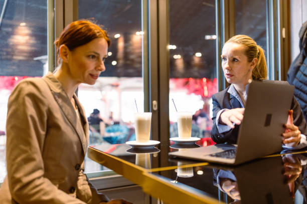 istock Colleagues business talk in a cafeteria 1494907621