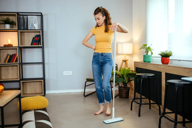 istock Barefoot woman cleaning floor with wet mop 1494907729