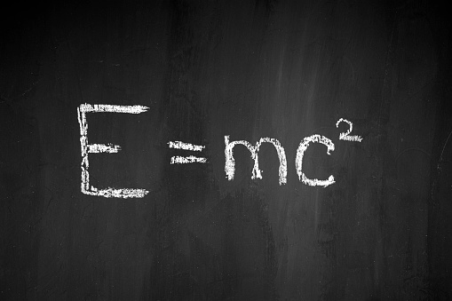 physical formula. Black school board. E mc2