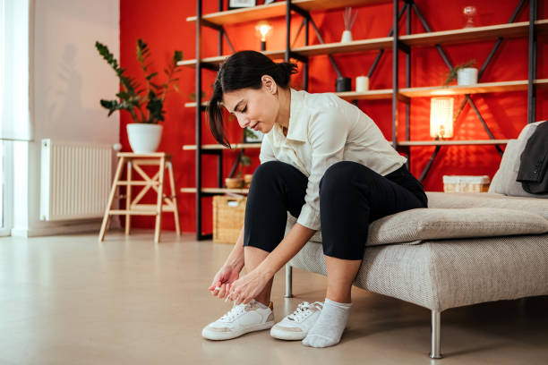 istock Woman is tying shoelaces 1494909556