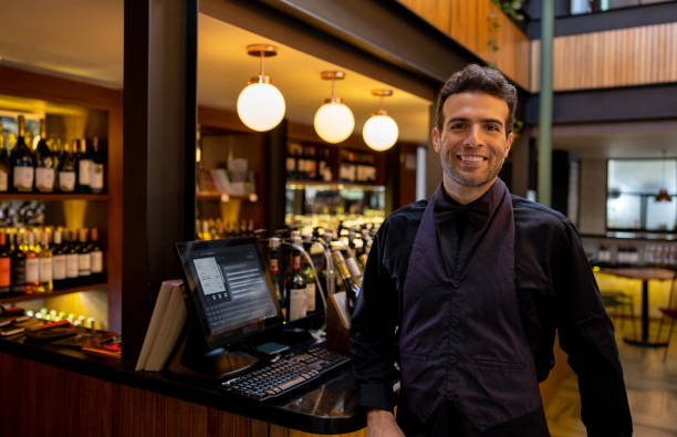istock Portrait of a happy host working at a restaurant and smiling 1494912706
