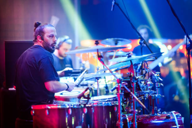 istock The drummer plays live music on stage 1494913101
