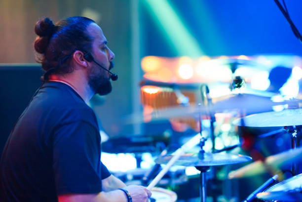 istock The drummer plays live music on stage 1494913104