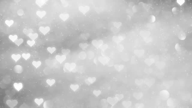 Silver magic shiny hearts bokeh background. Concept Love animation.