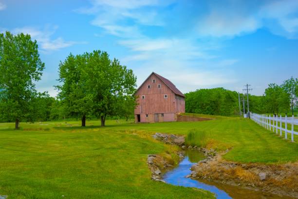 istock Old Weathered barn with fence and stream- Miami County, Indiana 1494920480
