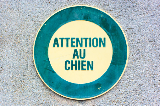 France: Old-Fashioned Sign Reading ATTENTION AU CHIEN, BEWARE OF DOG