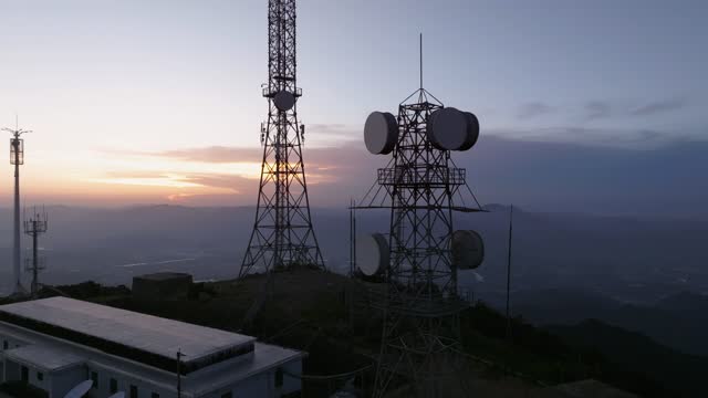 5G tower on montain at sunset