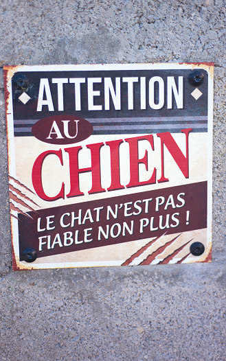 France: Humorous Old-Fashioned Sign Reading ATTENTION AU CHIEN, BEWARE OF DOG, THE CAT ISN’T WEAK EITHER!