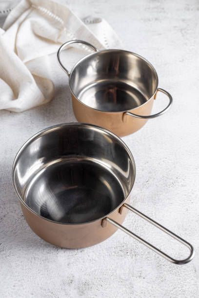 istock Set of cookware on the table. Metallic pans. 1494950680