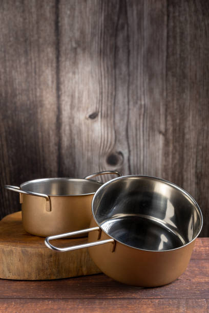 istock Set of cookware on the table. Metallic pans. 1494950683