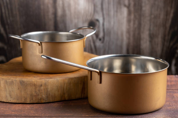istock Set of cookware on the table. Metallic pans. 1494950724