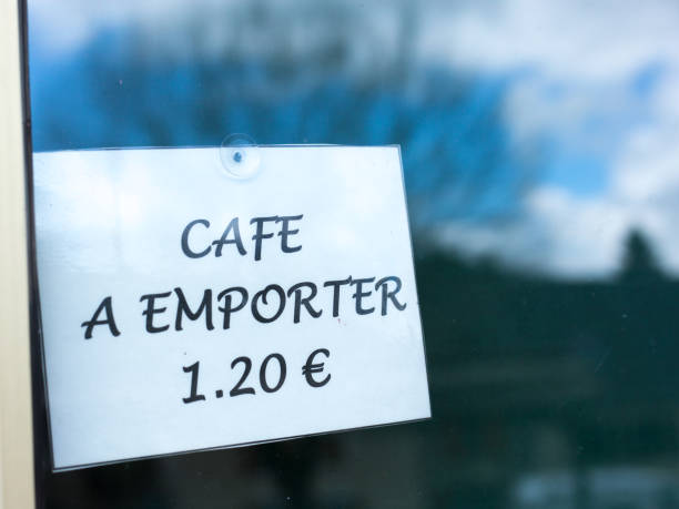 istock France: Paper Sign on Window: CAFE A EMPORTER (Take-Away Coffee) 1494952857